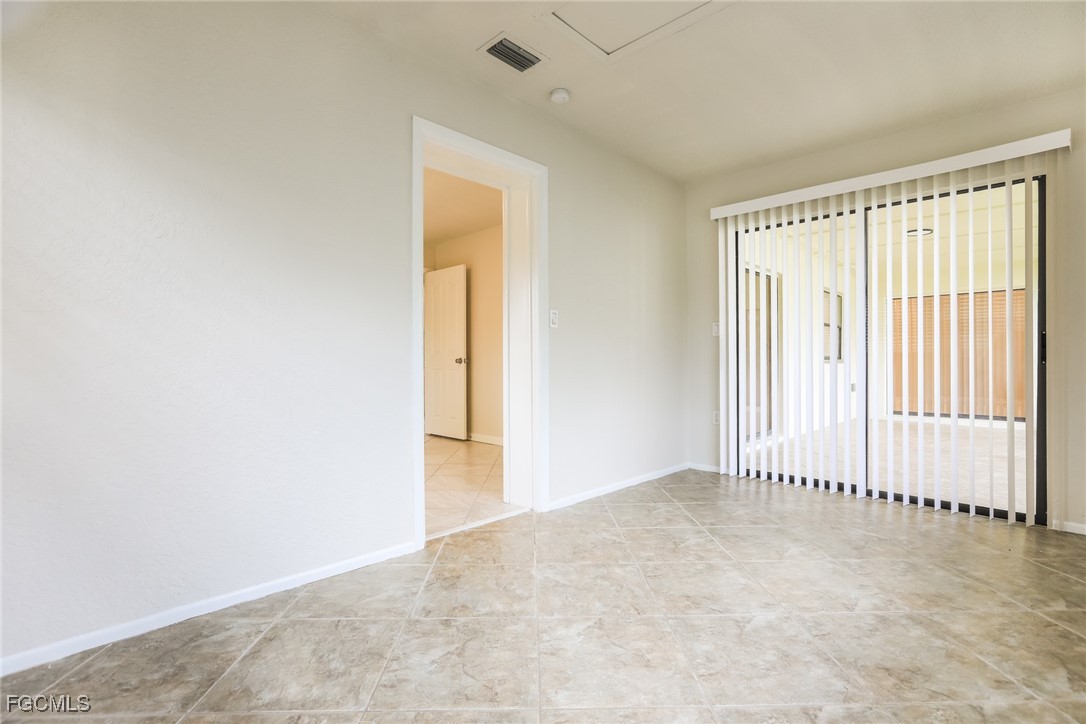 4024 Gingold Street Port Charlotte, FL 33948 - Photo 13 of 16 an empty room with a empty space and windows