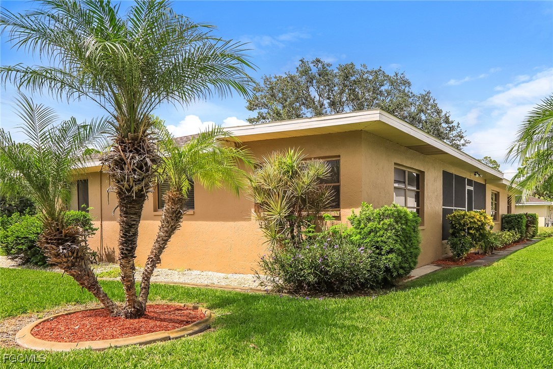 4024 Gingold Street Port Charlotte, FL 33948 - Photo 15 of 16 a front view of house with yard and green space