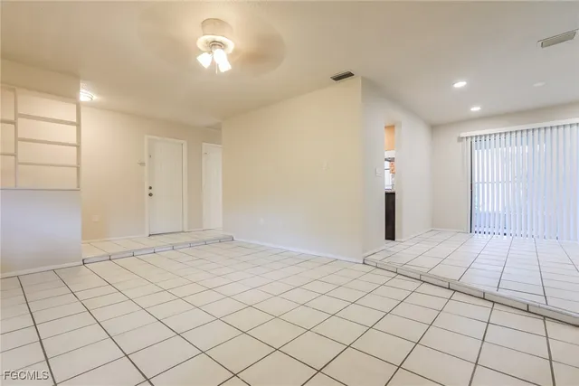 a view of an empty room and window