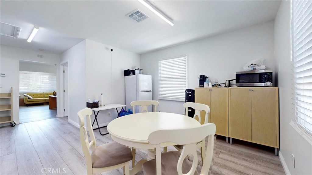 6851 Foothill Boulevard Tujunga, CA 91042 - Photo 23 of 50 a view of a dining room with furniture and wooden floor