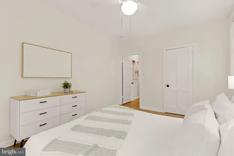 a bedroom with a bed and a dresser