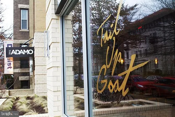 a view of a building with a glass door