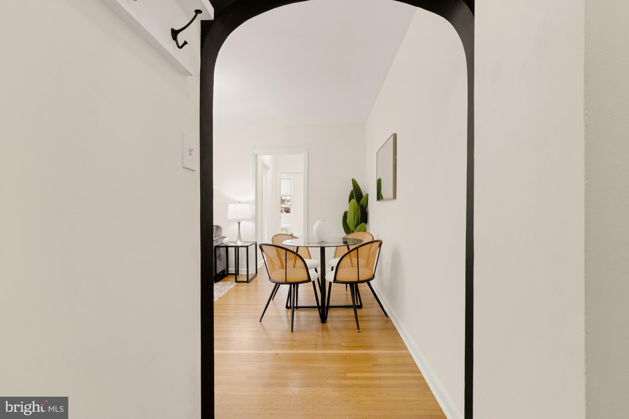 2801 Adams Mill Road Northwest, Unit 210 Washington, DC 20009 - Photo 3 of 32 a view of a room with furniture and wooden floor