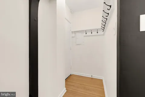 a view of a room with furniture and wooden floor