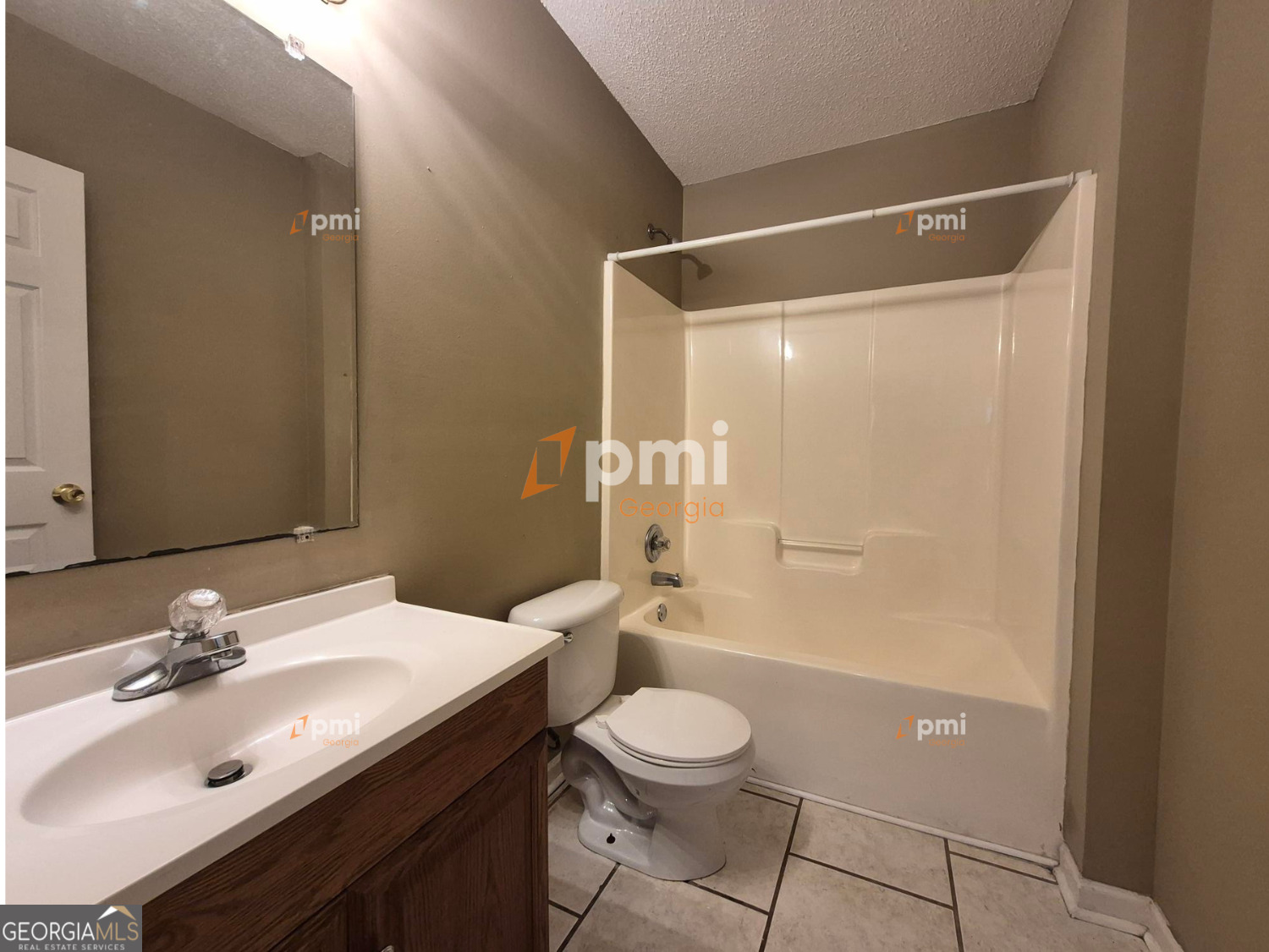 342 Orchard Way Warner Robins, GA 31088 - Photo 12 of 15 a bathroom with a sink a toilet and shower