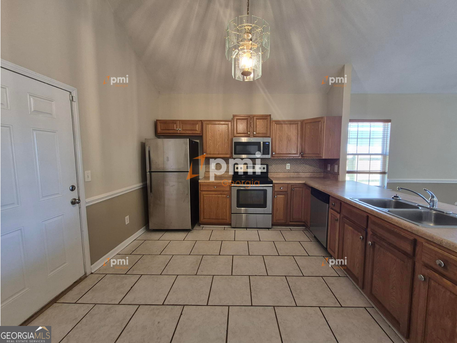 342 Orchard Way Warner Robins, GA 31088 - Photo 2 of 15 a kitchen with stainless steel appliances cabinets a sink and a counter top space