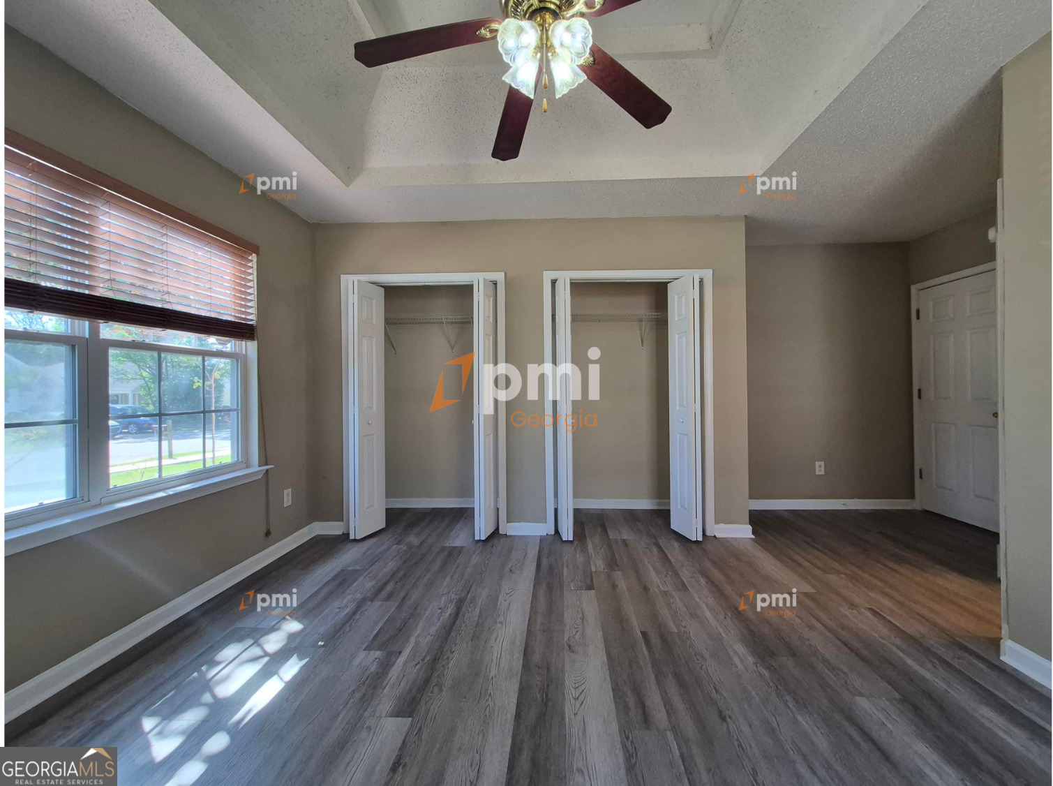 342 Orchard Way Warner Robins, GA 31088 - Photo 9 of 15 wooden floor in an empty room with a window