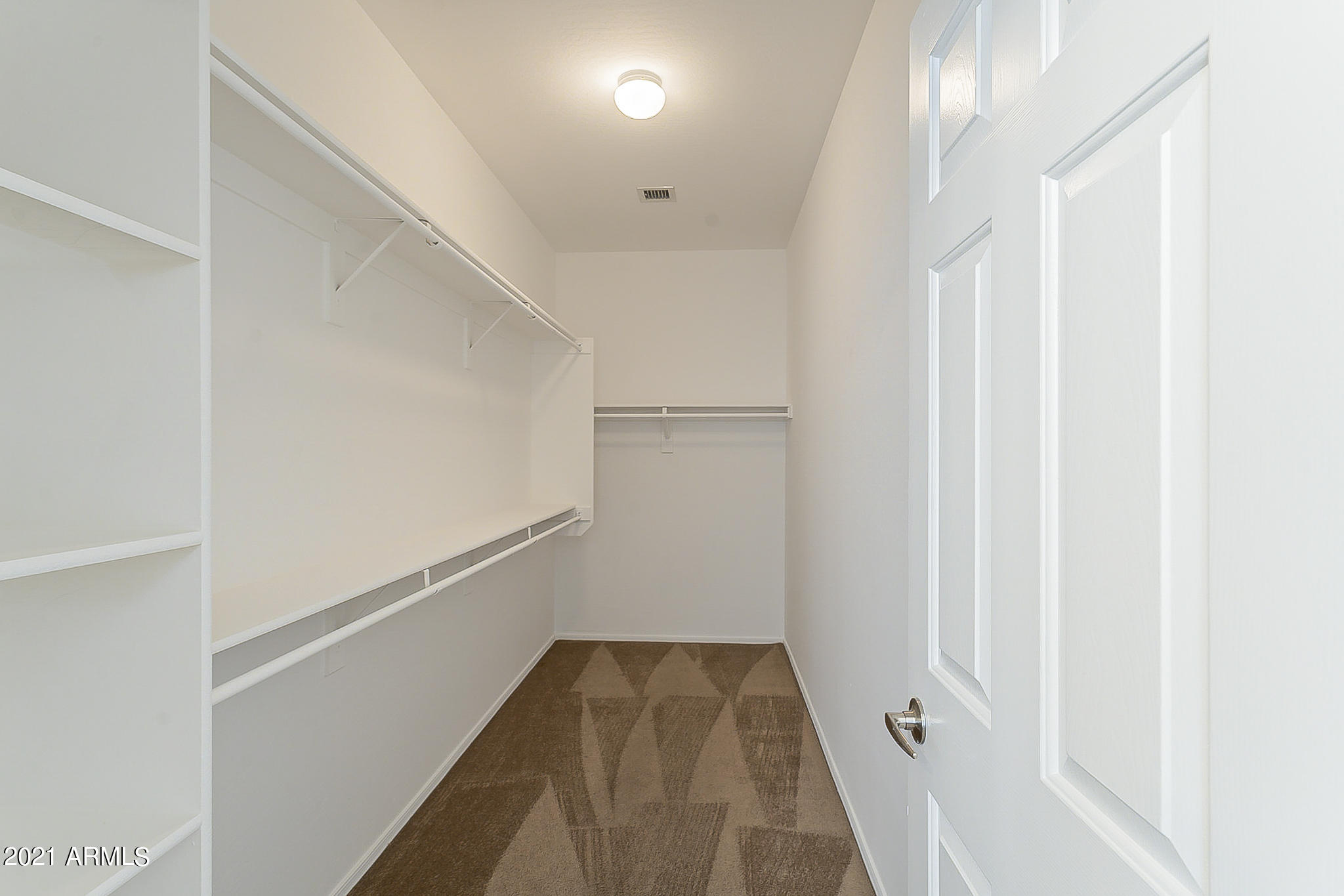 15346 West Boca Raton Road Surprise, AZ 85379 - Photo 31 of 45 a view of walk in closet with empty racks