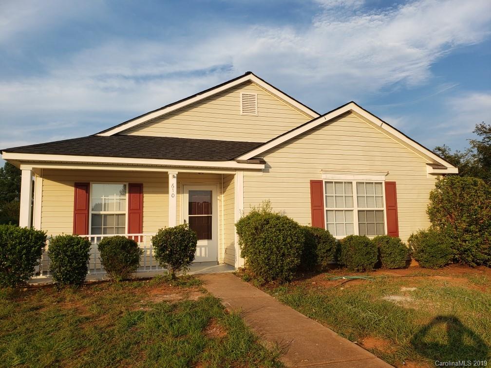 9610 Rau Court Charlotte, NC 28215 - Photo 2 of 10 a view of a house with backyard and plants