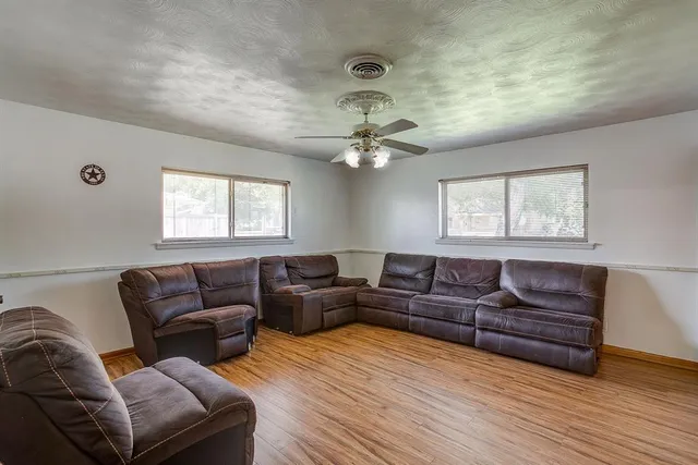 a living room with furniture and a window