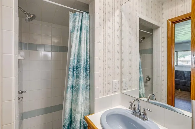 a bathroom with a sink and a mirror