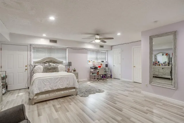 a bed room with furniture and a window