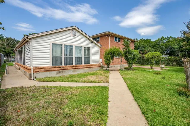 a front view of a house with a yard and porch