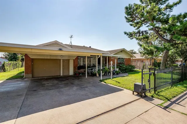 a view of a house with backyard porch and sitting area