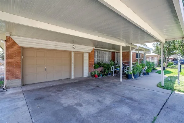 an empty room with potted plants