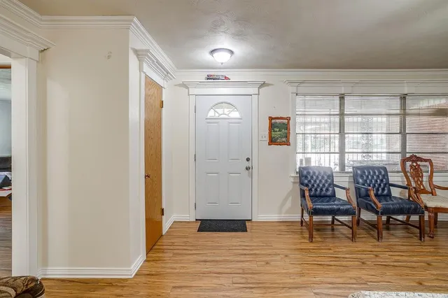 a view of a livingroom with furniture and wooden floor