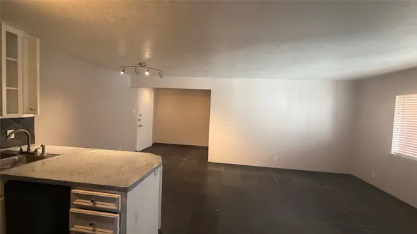 a view of a kitchen with a sink and dishwasher