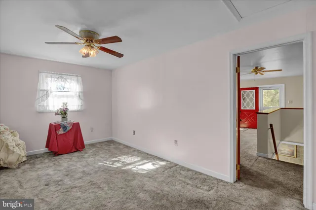 a view of a livingroom with furniture window and wooden floor