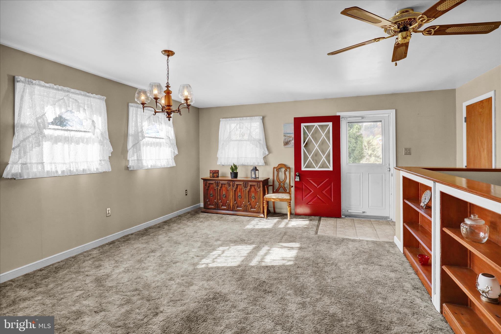 70 Mullen Road Birdsboro, PA 19508 - Photo 18 of 38 a living room with furniture and a chandelier