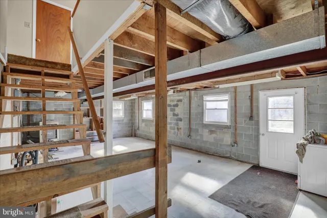 a view of a room with wooden walls