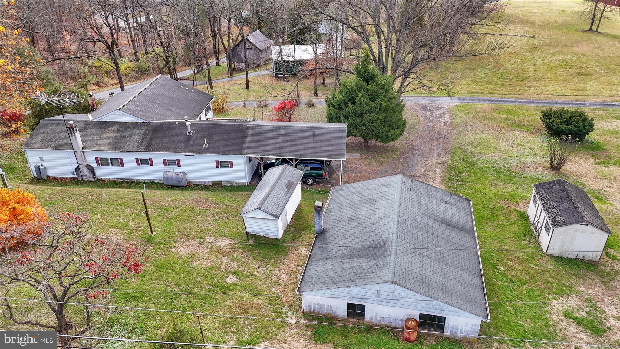 70 Mullen Road Birdsboro, PA 19508 - Photo 37 of 38 an aerial view of a house with swimming pool and large trees