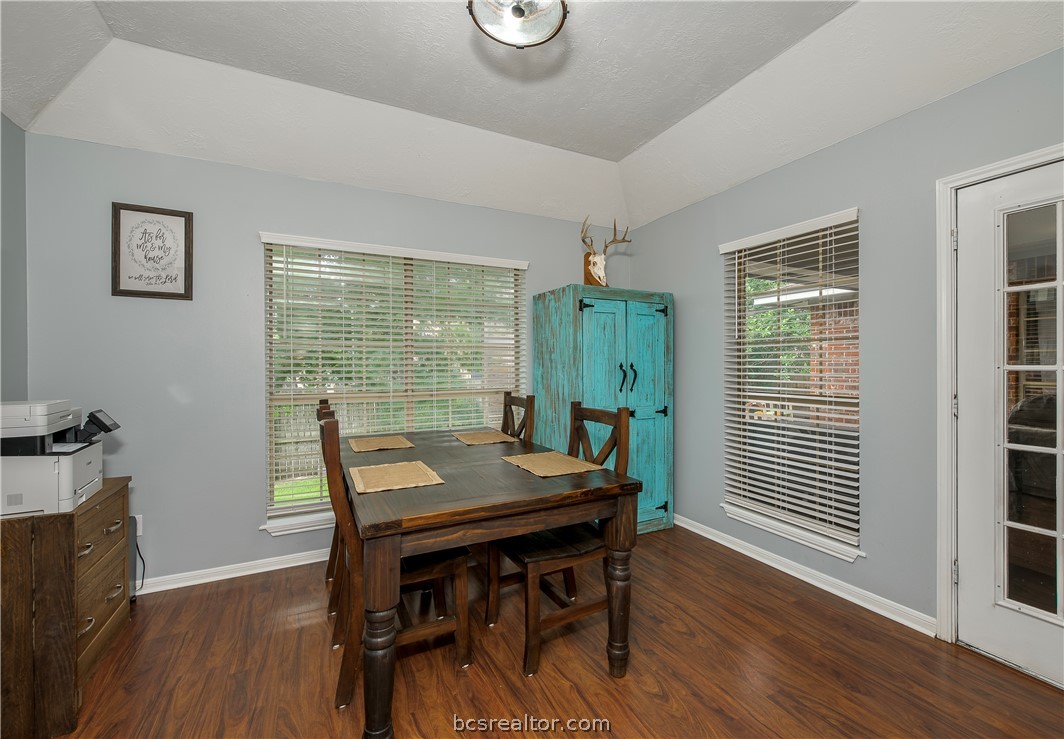 2009 Cobblestone Lane Bryan, TX 77807 - Photo 11 of 23 a view of a dining room with furniture window and wooden floor