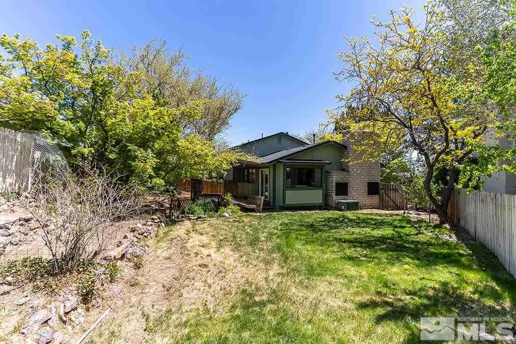 3685 Renee Way Reno, NV 89503 - Photo 25 of 26 a front view of a house with a yard