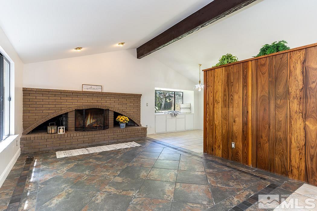 3685 Renee Way Reno, NV 89503 - Photo 5 of 26 a view of a livingroom with a fireplace garage and window