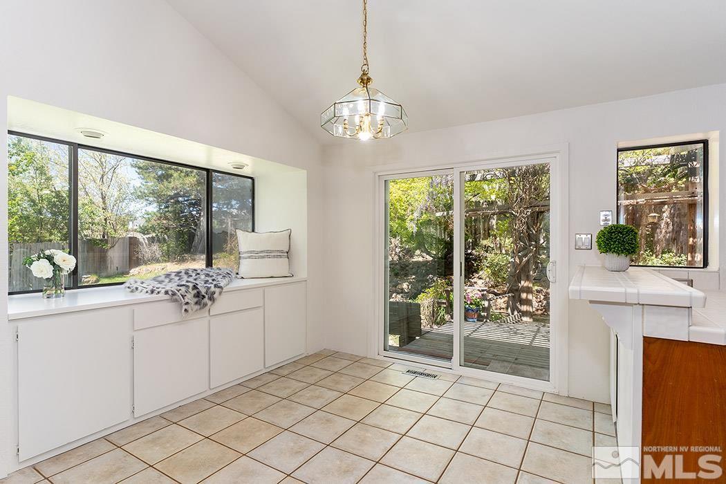 3685 Renee Way Reno, NV 89503 - Photo 7 of 26 a view of a room with furniture large windows and wooden floor