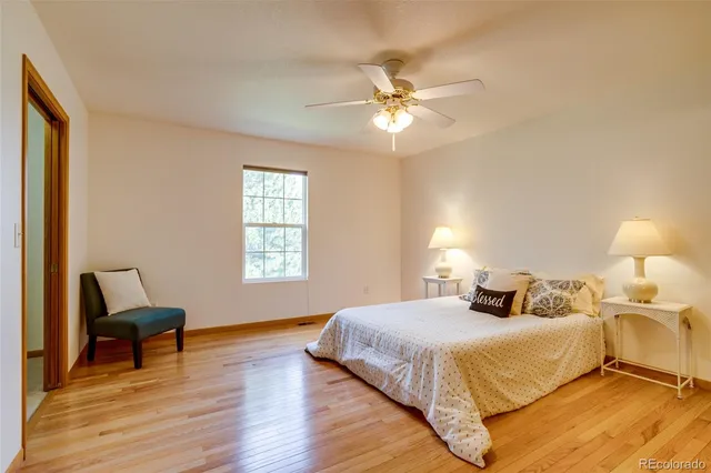 a bedroom with a bed and a chair