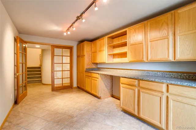 a view of a kitchen with a sink and cabinets