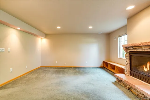 an empty room with a fireplace