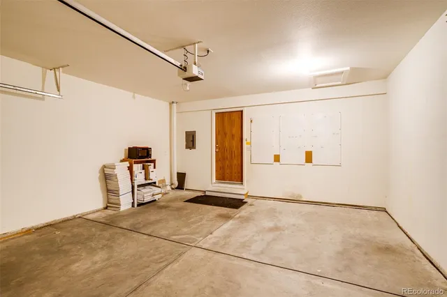 a view of a storage & utility room with two washing machine