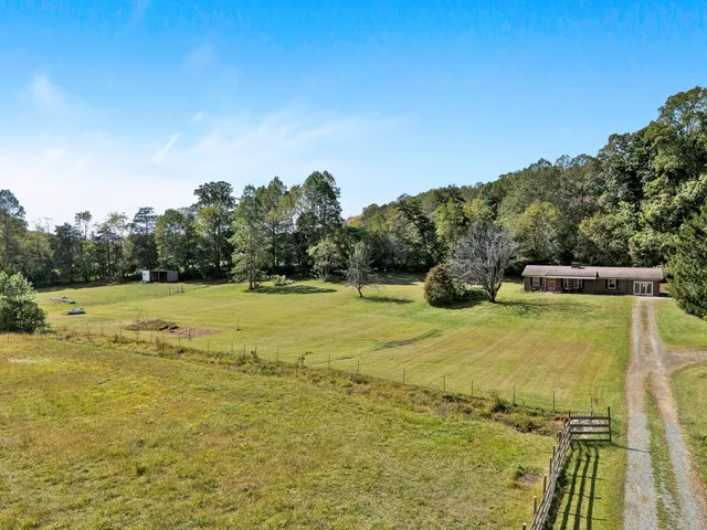 a view of a swimming pool with an outdoor seating