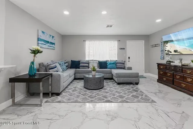 a living room with furniture and a couch