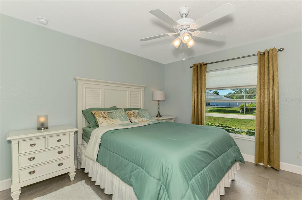 13049 Ridgely Circle Port Charlotte, FL 33981 - Photo 17 of 49 a bedroom with a bed and a window