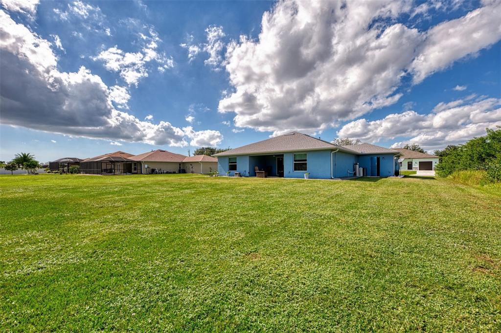 13049 Ridgely Circle Port Charlotte, FL 33981 - Photo 27 of 49 a front view of house with yard