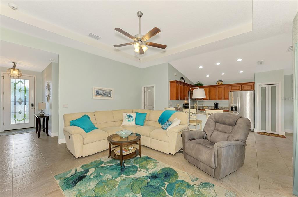 13049 Ridgely Circle Port Charlotte, FL 33981 - Photo 36 of 49 a living room with furniture and a view of kitchen