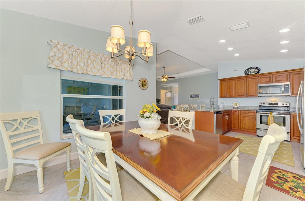 13049 Ridgely Circle Port Charlotte, FL 33981 - Photo 48 of 49 a view of a dining room with furniture