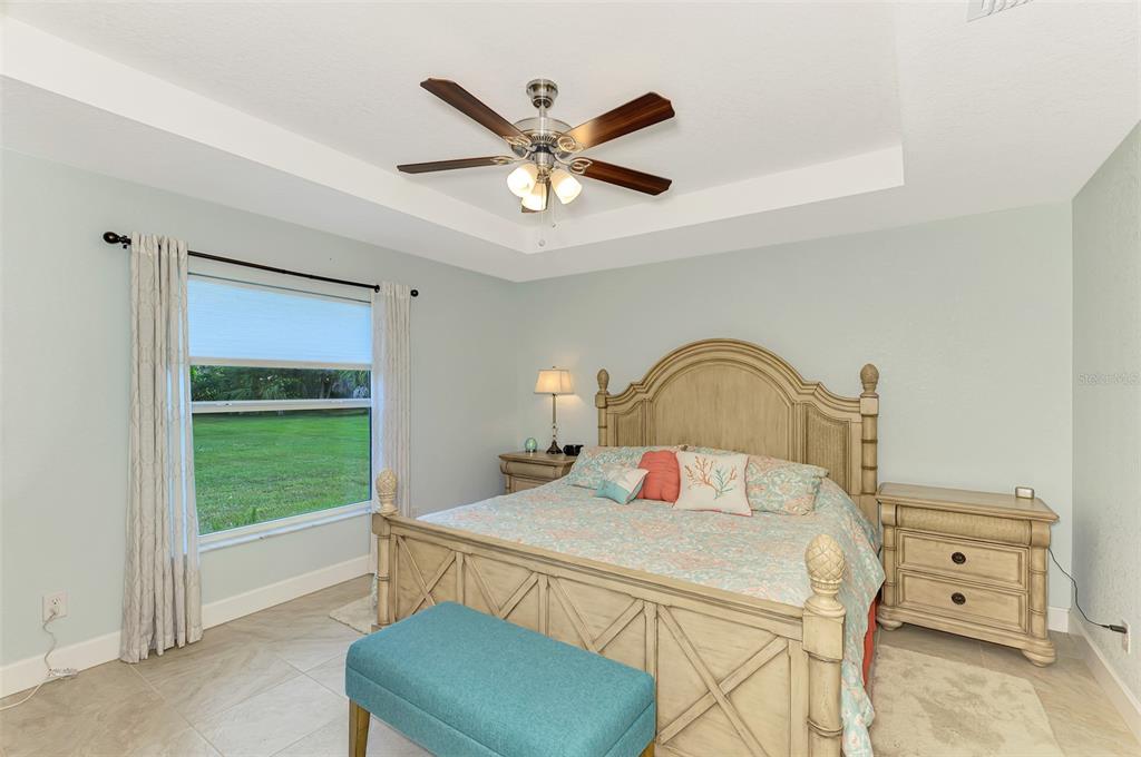 13049 Ridgely Circle Port Charlotte, FL 33981 - Photo 9 of 49 a bedroom with a bed and a window