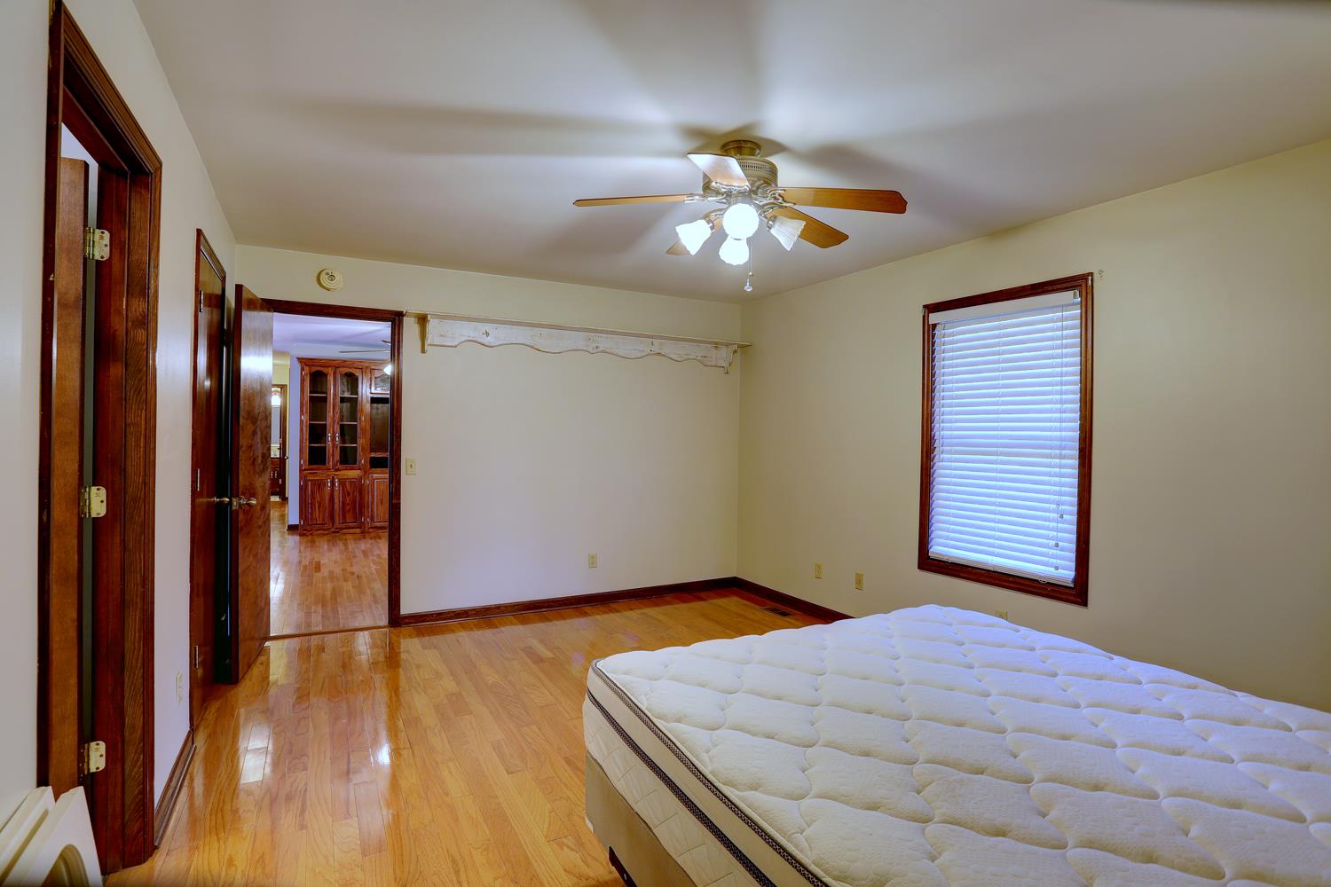4809 Charles Dorris Road Springfield, TN 37172 - Photo 15 of 27 a bedroom with a bed and a chandelier