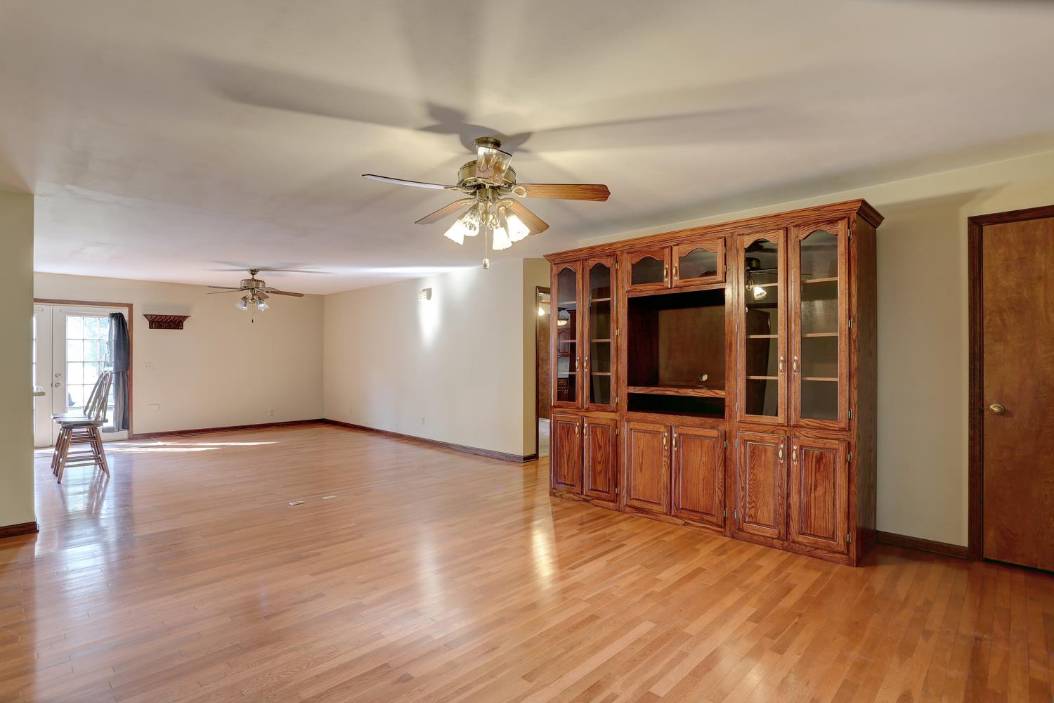 4809 Charles Dorris Road Springfield, TN 37172 - Photo 16 of 27 a view of an empty room with window and wooden floor