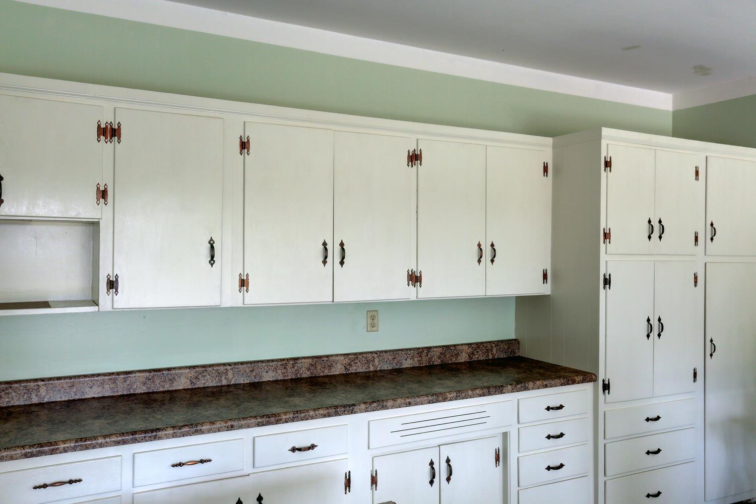 4809 Charles Dorris Road Springfield, TN 37172 - Photo 6 of 27 a kitchen with granite countertop white cabinets and white appliances
