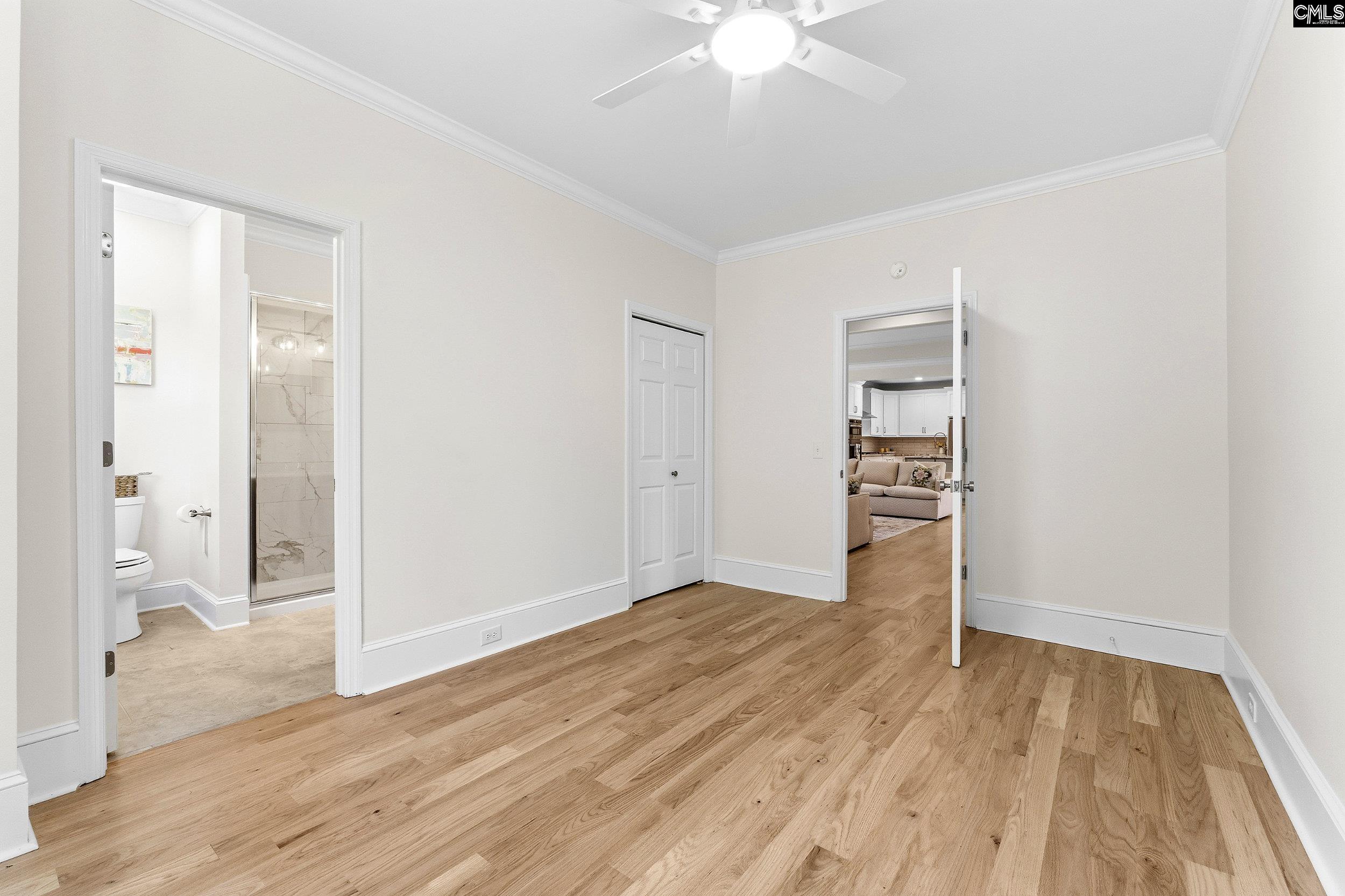 121 Silver Lake Road East Columbia, SC 29223 - Photo 28 of 57 an empty room with wooden floor closet and windows