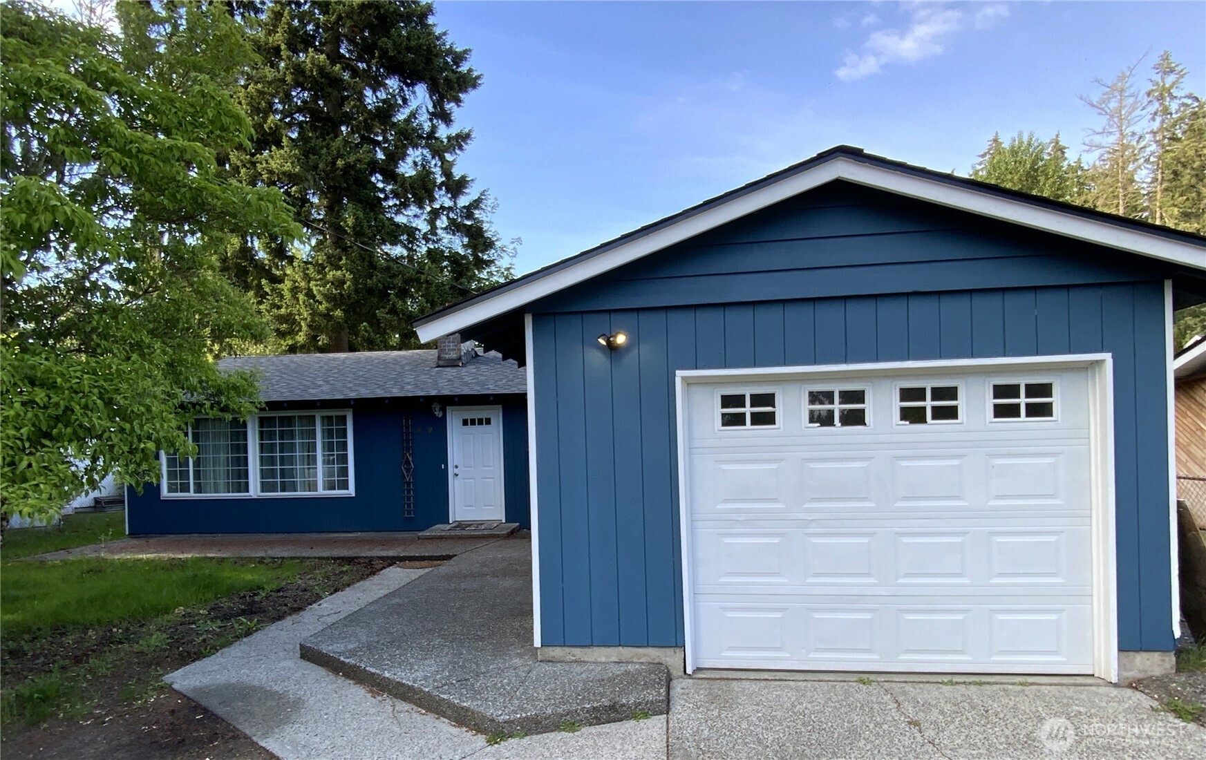 621 Brookdale Road East Tacoma, WA 98445 - Photo 1 of 14 a front view of a house with garage