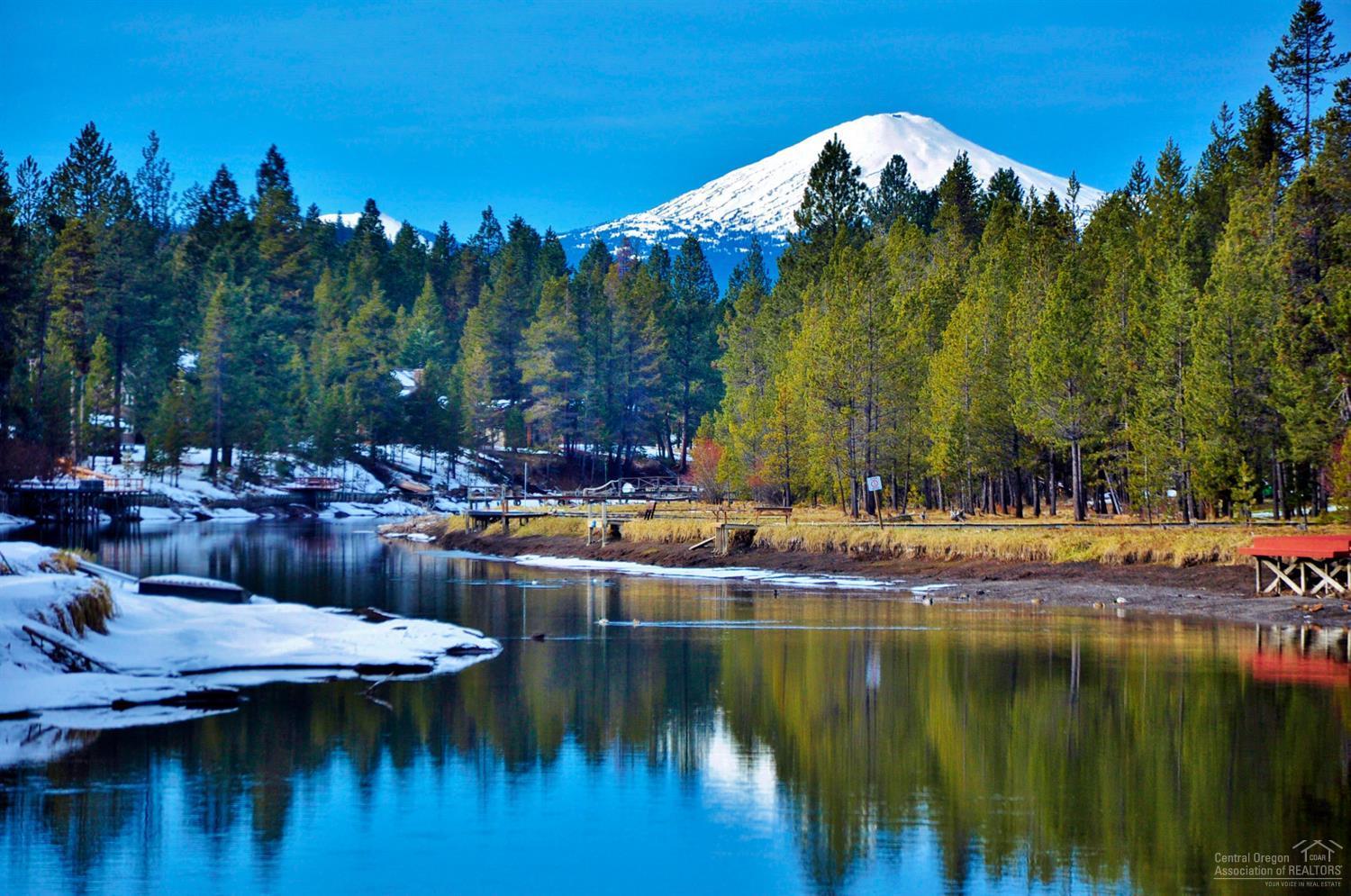 56082 Snow Goose Road Bend, OR 97707 - Photo 8 of 8 a view of a lake with a building in the background