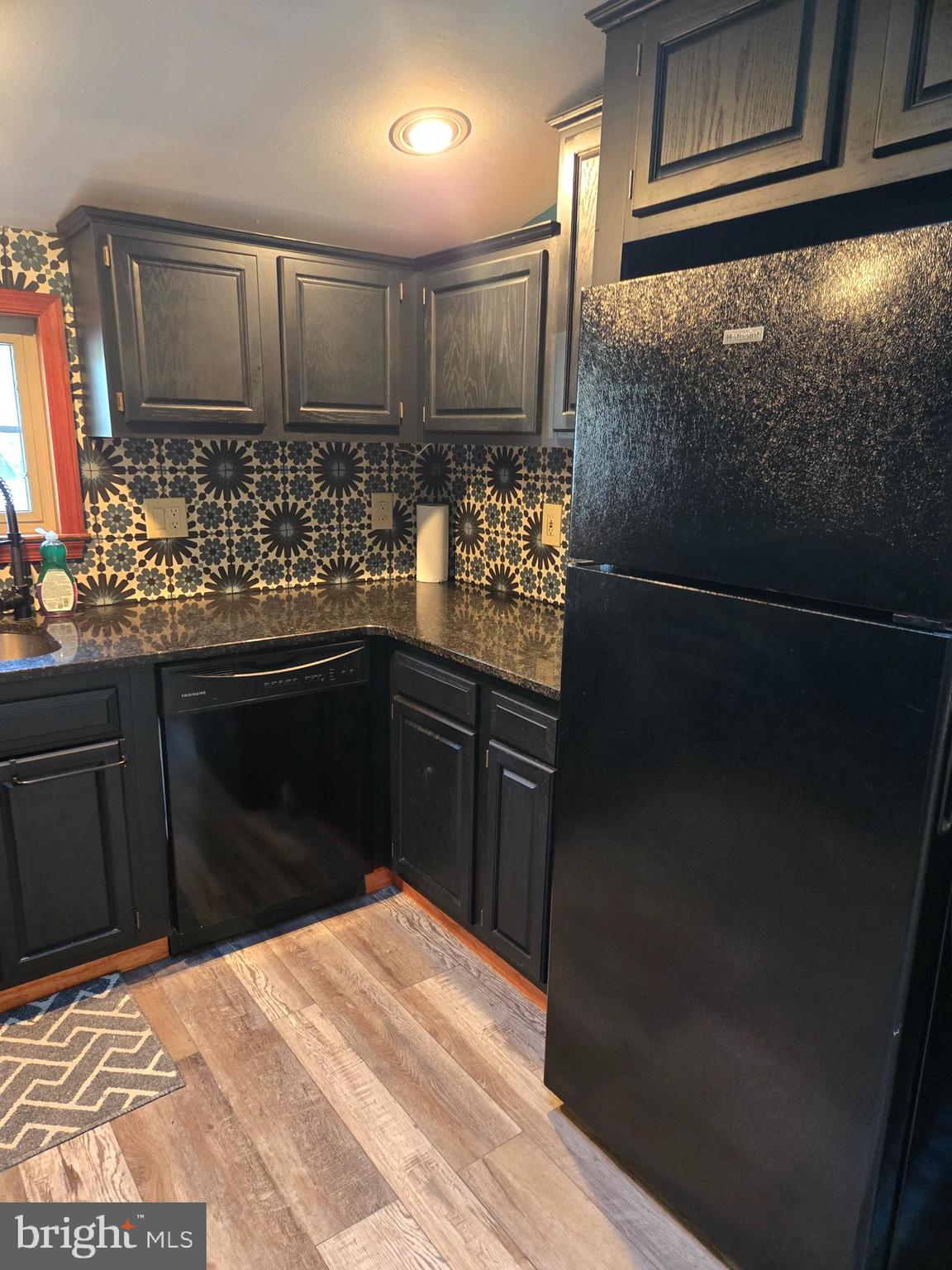 127 3rd Avenue Pitman, NJ 08071 - Photo 12 of 15 a kitchen with stainless steel appliances kitchen island granite countertop a refrigerator and a stove