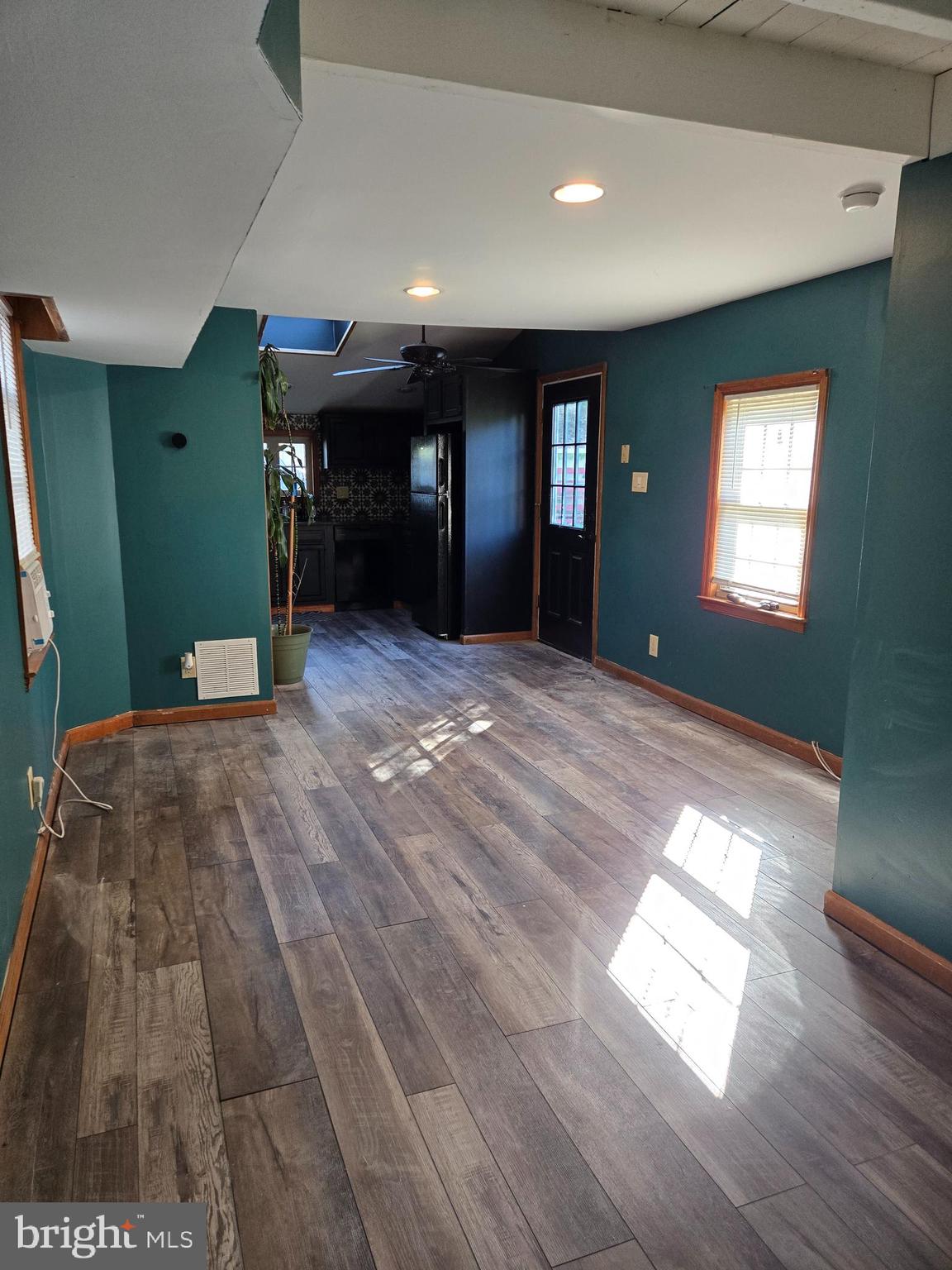 127 3rd Avenue Pitman, NJ 08071 - Photo 6 of 15 a view of empty room with wooden floor and window