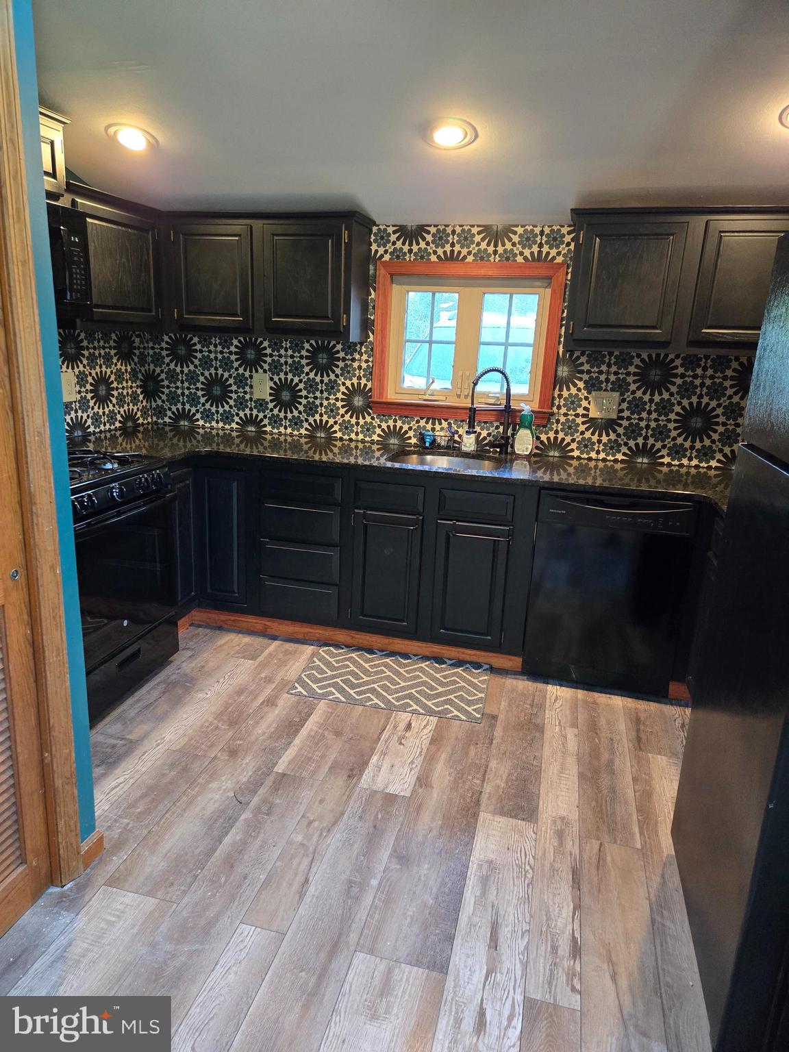 127 3rd Avenue Pitman, NJ 08071 - Photo 10 of 15 a kitchen with stainless steel appliances a sink stove and cabinets