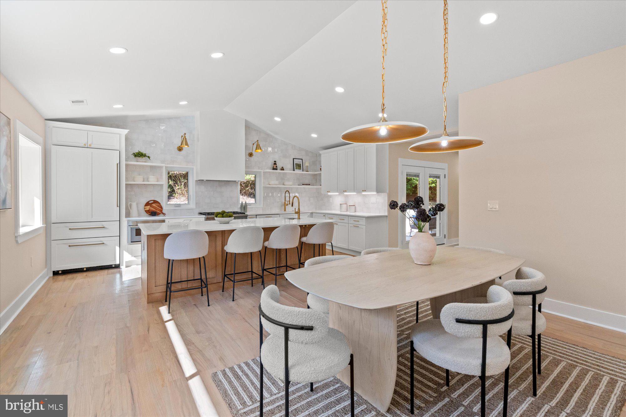 6125 Overlea Road Bethesda, MD 20816 - Photo 17 of 61 a view of a dining room with furniture and wooden floor